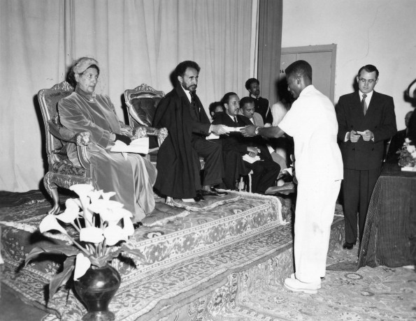 Haile Selassie I, Emperor of Ethiopia, giving diplomas to graduates at the Seventh-day Adventist school in Ethopia