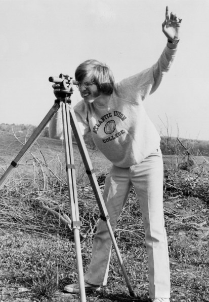 Atlantic Union College student operating surveying instrument