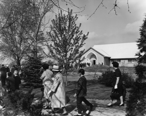 Village Seventh-day Adventist Church members walking from their old church home to the new building in the early 1960s (Berrien Springs, Mich.)