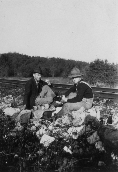 Clinton Theological Seminary students on a pecan nutting outing sitting by the railroad tracks