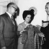Congressman Jerry Pettis, Mrs. John Kronke, and Mayor Edgar Kesterke examine a coat made from leftover fabric at the Berrien Springs Community Services Center (Mich.)