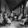 Battle Creek Sanitarium patients in wheelchairs on a covered portico