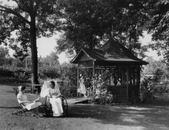 Hinsdale Sanitarium and Hospital patient and her nurse enjoying the grounds