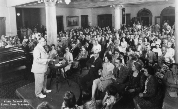 Battle Creek Sanitarium guests listen to Dr. John H. Kellogg during his weekly Question Box session