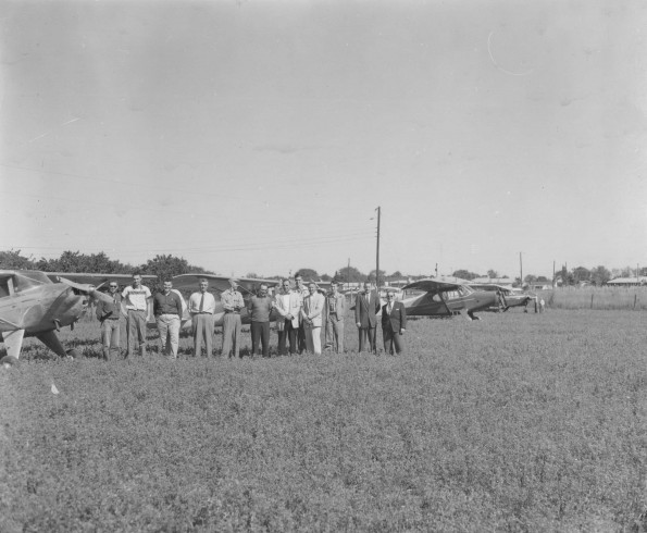 Andrews University flying club members with their planes