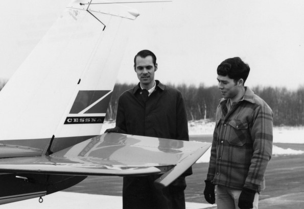William Barney and Tom Candy inspecting a plane's elevator at Andrews University airport