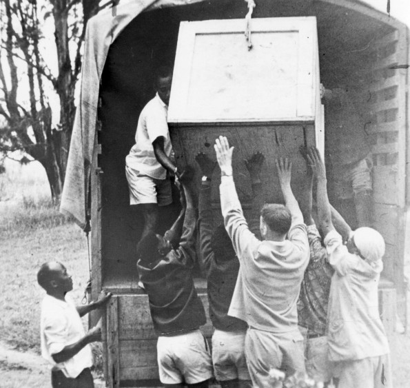 Andrews University alumni helping to load a Whirlpool refrigerator for the teaching of home economics at Bugema Missionary College