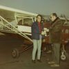 A pilot receive a reward in front of his plane