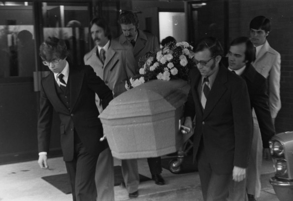 Family and friends carrying the coffin of Andrews University flight instructor Darrell Duane Dicken