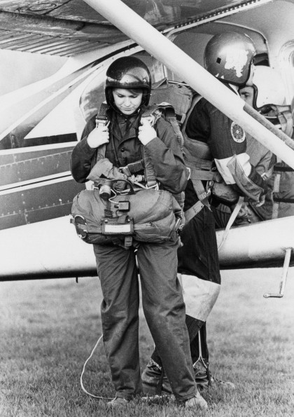 Wendy Sterner Manning carrying her parashute preparing to get on a plane