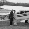 A couple in front of the Leo Halliwell lake amphibian plane destined for mission service in Brazil