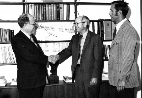 Andrews University president Richard L Hammill hand shaking with J Edward Hutchinson