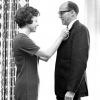 Andrews University board of trustees 1966-1967 member pinning on a boutonniere