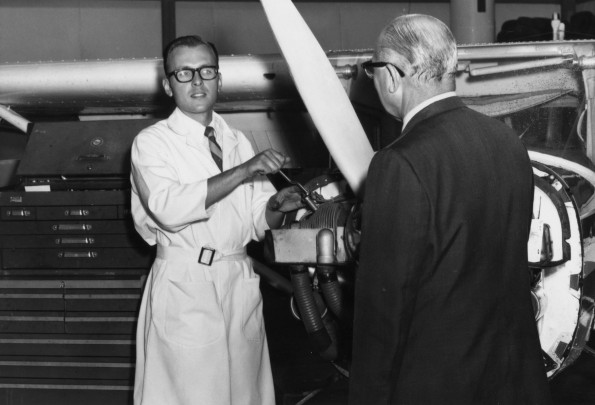 Vernon Edward Garber visited the Andrews University Airport aviation department while Alfred Fox was maintaing a plane engine