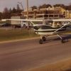 A plane taking off from a run way in front of the science complex at Andrews University