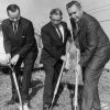 Three men at a breaking ground event for Andrews University aviation building construction