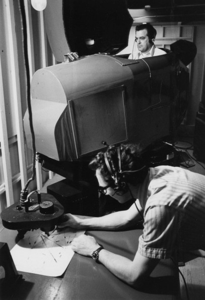 Melvin Krause and Andy Mo0re testing the Link trainer flight simulator at the Andrews University Airport