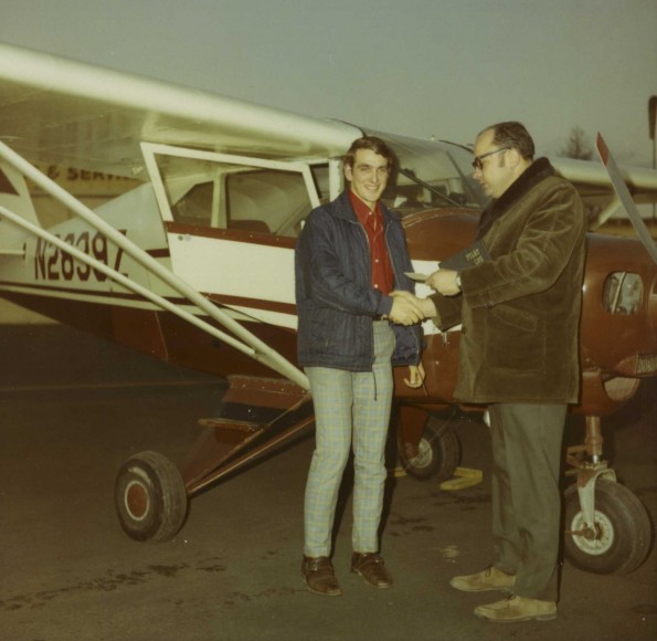 A pilot receive a reward in front of his plane
