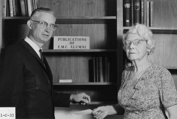 [Mrs. Piper presenting a check to Leonard Hill during the 1972 Andrews University alumni homecoming weekend]