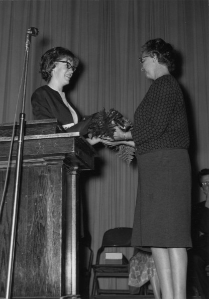 [Bonnie Jean Hannah is presented with a thank you gift for her help with the 1966 Andrews University yearbook, the Cardinal]