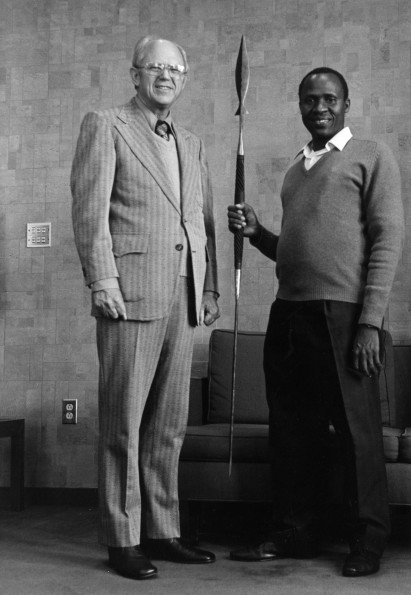 [Richard Hammill and John Kisaka standing with a Tanzanian spear]