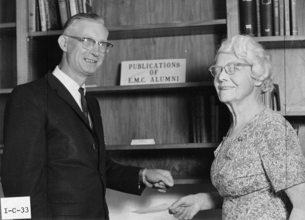 [Mrs. Piper presenting a check to Leonard Hill during the 1972 Andrews University alumni homecoming weekend]