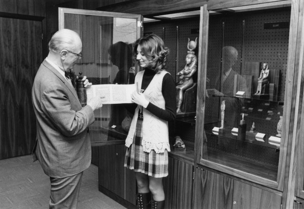 [Siegfried Horn showing Rachel Cameron an Esther scroll in the Andrews University Archaeological Museum]