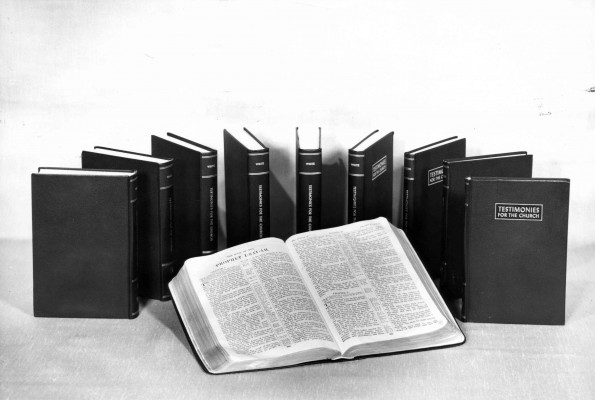 [Ellen G. White's nine volumes of testimonies for the church surrounding a King James Bible]