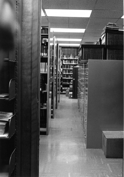 [Library stacks at the James White Library]