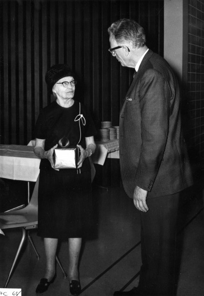 Mrs. G. R. Fattic (Andrews University alumnus) recieves a gift from Horace Shaw