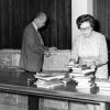 [Richard Powell and Olivia Harder unpacking books for the annual display at the James White Library]