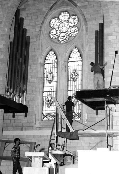 [Installing new pipes for the Casvant pipe organ at Pioneer Memorial Church]