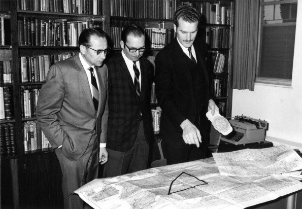 Loren Fenton, an Andrews University Seventh-day Adventist Theological Seminary student, shows his project trip itinerary to the supervisor, Arnold Kurtz, and to Charles Brown