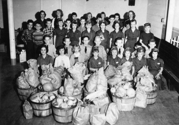 [The Berrien Springs Pathfinder club with food from the Thanksgiving food drive]
