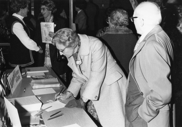 [The Youngs registering for Andrews University alumni homecoming, 1973]