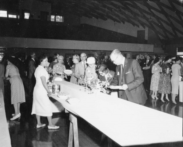 Refreshment table in Johnson Gymnasium prior to the Andrews University alumni Homecoming banquet, 1960