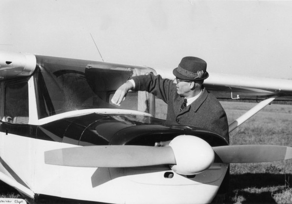 Edwin Buck, who is presant at Andrews University alumni South-Western Michigan Chapter, cleanses windshield of an air plane
