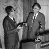 Ralph Waddell, the 1966 Andrews University Alumnus of the Year, receives a gift from Horace Shaw