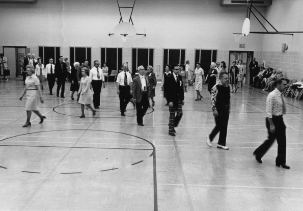 [Alumni take part in a  march   at the Ruth Murdoch Elementery School cafetorium during Andrews University's 1972 alumni homecoming weekend]