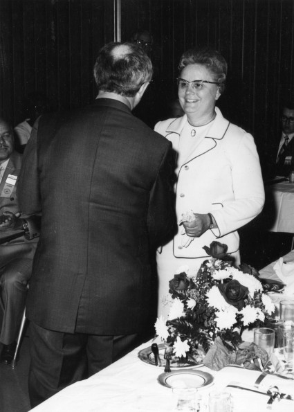 [Mildred Alma Summerton receiving recognition from Richard Hammill during Andrews University's 1971 alumni homecoming]