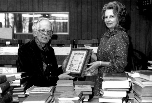 [Horace Shaw and Louise Dederen with donations to the Andrews University Heritage Room]