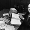 [Otto Christensen with a handwritten Old Testament in the Mongolian language displayed in the Andrews University Heritage Room]