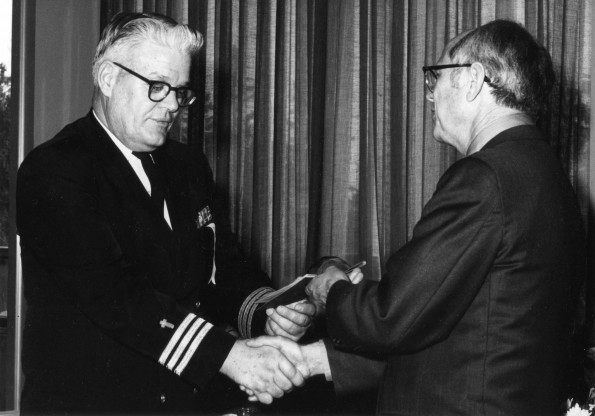 [Robert L. Mole receives an award from Hammill during Andrews University's 1971 alumni homecoming]