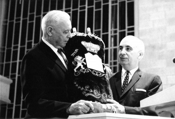 [W.G.C. Murdoch accepting a rare torah scroll from George Suhrie on behalf of the James White Library]
