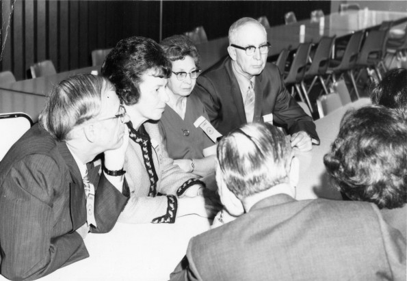 [Edwin and Elsie Buck talking with C. N. Keiser, his wife, and others at the 1972 Andrews University alumni weekend luncheon]