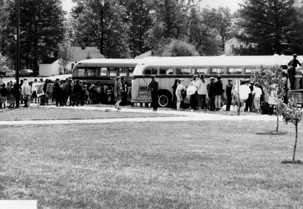[Pathfinders loading buses for a weekend of camping by Lake Allegan]