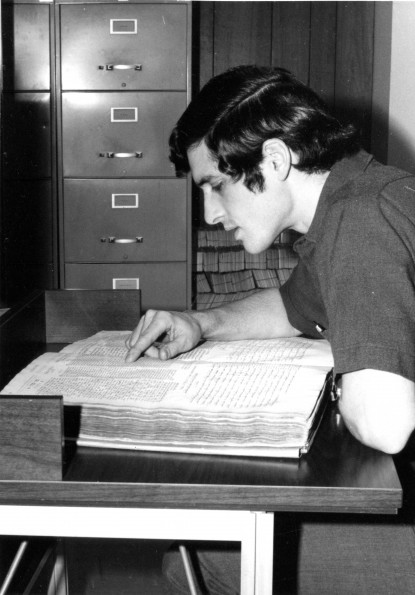 [Student studying a Hebrew Bible at the James White Library]