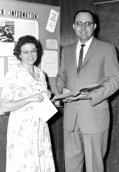 [Marilyn Fivash standing with an unknown gentleman in the James White Library]