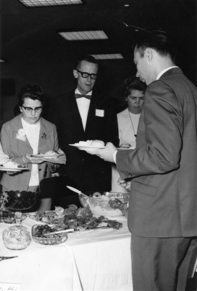 Alumni of Andrews University having a meal at Homecoming alumni banquet in 1966