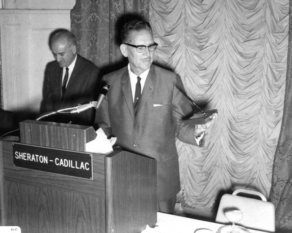 Ralph Waddell, 1966 Andrews University Alumnus of the Year, holds a pen holder presented to him at the Alumni reunion luncheon at the Sheraton-Cadillac Hotel, Detroit, Michigan, 1966
